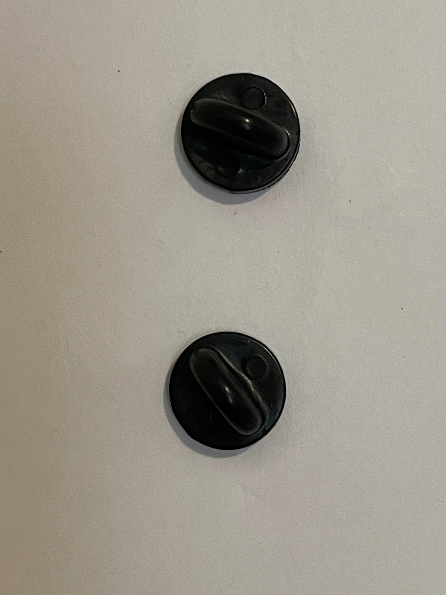 2 solid secure backs on pin