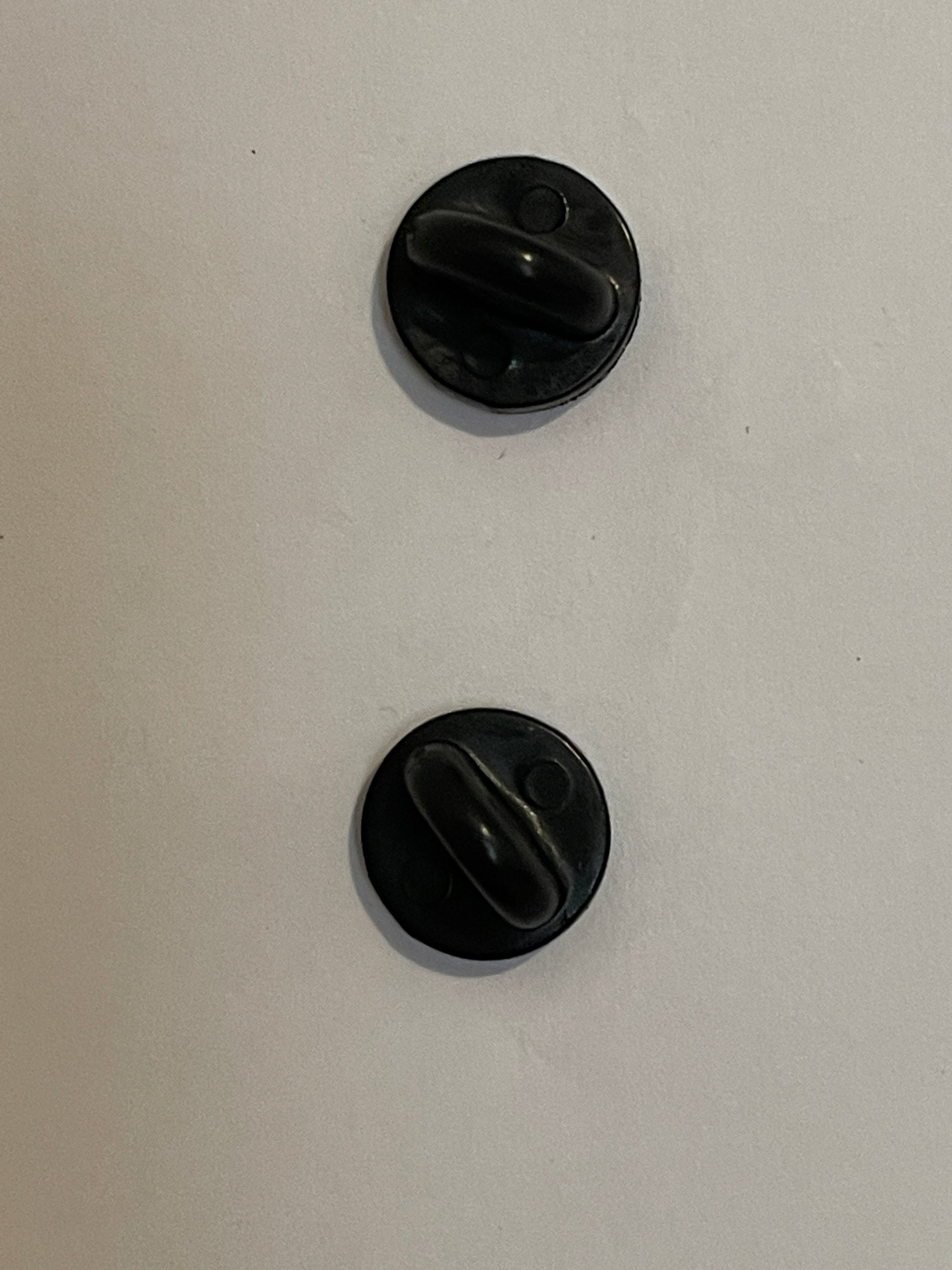 2 solid secure backs on pin